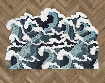 May include: A blue and white rug with a wave design. The rug is made of a soft, fluffy material and has a unique, abstract pattern.