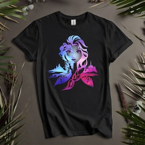 May include: Black t-shirt with a colorful graphic of Elsa from Frozen. The graphic features Elsa's face and hair, with a castle and ice crystals in the background.