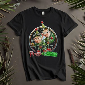 Camisetas personalizadas retro divertidas de la película navideña Prep Landing para hombres, mujeres y niños. Tallas S a 5XL. Camisetas para mujer disponibles. K690