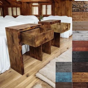 May include: Two wooden nightstands with drawers, one drawer is open. The nightstands are made of reclaimed wood and have a rustic finish. The nightstands are in a bedroom setting with a white bed and a rug on the floor. The image also shows a variety of wood finishes that are available for the nightstands.