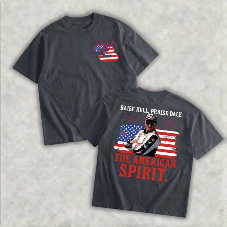 a black t-shirt with a graphic design on the back, depicting a person wearing sunglasses and a baseball cap. The design includes an American flag and the text "Raise Hell, Praise Dale" printed on the shirt.