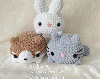 May include: Four crocheted stuffed animals: a white bunny, a brown and white dog, a gray cat, and a spotted gray cat. The text "PDF Pattern only @xochit/mochi_crochet" is at the top of the image. The text "Loaf bunny -Loaf kitten regular -Loaf kitten spotted -Loaf shiba pup" is at the bottom of the image.
