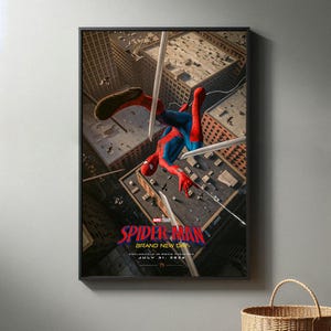 May include: A framed movie poster featuring Spider-Man in a red and blue suit swinging between city buildings. The text reads SPIDER-MAN BRAND NEW DAY EXCLUSIVELY IN MOVIE THEATRES JULY 31, 2026. The scene is set above a dense urban landscape.