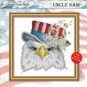 May include: Counted cross stitch pattern of Uncle Sam, a bald eagle wearing a red, white, and blue top hat with a floral embellishment. The pattern is framed and includes the text "Uncle Sam" and "Counted Cross Stitch".