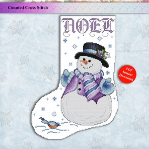 May include: A counted cross stitch pattern for a Christmas stocking featuring a snowman with a purple hat, scarf, and mittens. The stocking is decorated with snowflakes and the word "NOEL" in a decorative font. The pattern is available as a PDF instant download.