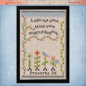 May include: Counted cross stitch pattern featuring a floral design with a bird and the text "Lean not unto thine own understanding. Proverbs 3:5".