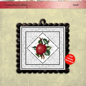 Puede incluir: Un patrón de punto de cruz contado titulado Blackwork Fruit Apple de Kitty Me Designs by Pamela Kellogg. El diseño presenta una manzana roja con hojas verdes centrada en un marco de diamante blackwork dentro de un marco cuadrado negro festoneado.