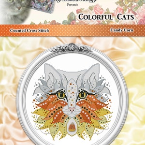Op de afbeelding: Een geteld kruissteekpatroon met een kat met een candy corn-ontwerp. Het patroon is getiteld "Kleurrijke katten: Candy Corn".