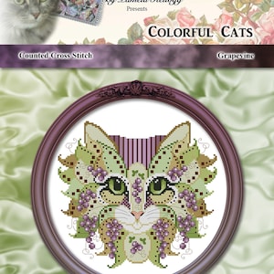 Op de afbeelding: Geteld kruissteekpatroon met een kleurrijke kat met druivenranken en bladeren. Het patroon is getiteld "Grapevine" en maakt deel uit van de "Colorful Cats" collectie van Kitty Me Designs.