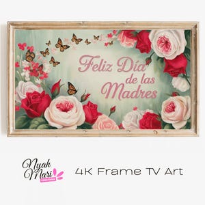 Op de afbeelding: Een ingelijst bloemenkunstwerk met de tekst "Feliz Día de las Madres". Het kunstwerk toont rode en witte rozen, vlinders en een zachte groene achtergrond. De lijst heeft een licht houten kleur. De woorden "4K Frame TV Art" staan onderaan.