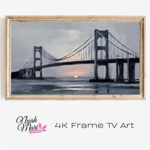 May include: A framed painting of a bridge at sunset. The bridge is gray, and the sky is a mix of gray and orange. The painting is labeled "4K Frame TV Art".