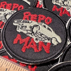 Repo Man Glow In The Dark Bügelbild