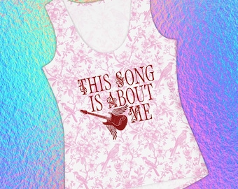 May include: A white sleeveless tank top featuring a repeating light pink floral and bird pattern. The center displays the dark red text THIS SONG IS ABOUT ME above a graphic of a dark red electric guitar with wings extending from its body.