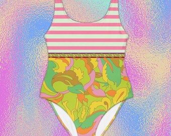 May include: A one-piece swimsuit featuring a scoop neckline and wide shoulder straps. The top section has horizontal pink and white stripes, while the bottom section displays a vibrant, multi-colored abstract floral pattern in shades of lime green, yellow, orange, and pink.