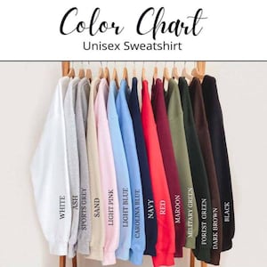 A color chart displaying various colored sweatshirts hanging on a rack, with each color labeled.
