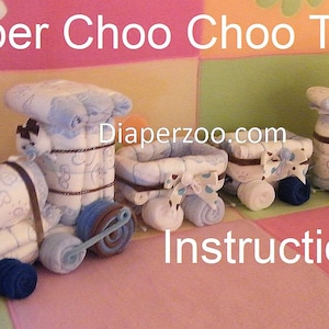 Instrucciones - Trencito de pañales. Pastel de pañales con luz nocturna. Aprende a hacerlo con pañales. ¡Genial para el recuerdo de tu bebé! Decoración de trencito. imagen 5