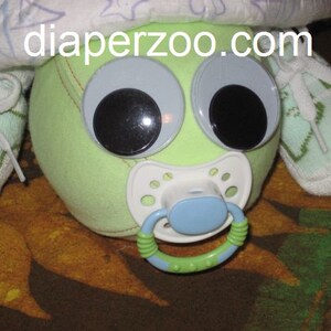 Learn how to make Scooter the Diaper Turtle. GR8 for baby nursery. Diaper cake keepsake image 4