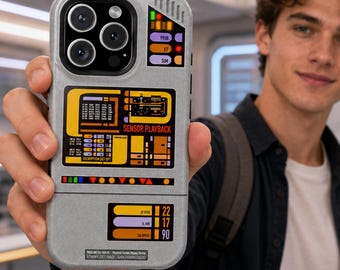 May include: A gray smartphone case featuring a sci-fi interface design with colorful rectangular graphics, numerical data, and the text SENSOR PLAYBACK. The case has a textured finish and cutouts for a triple-lens camera system on the back.