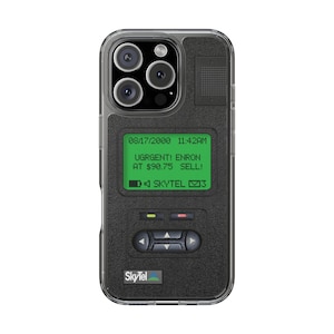 May include: A clear phone case with a black and green screen displaying a message that reads "URGENT! ENRON AT $90.75 SELL!" The date and time are displayed as "08/17/2000 11:42AM". The case has a black textured surface and the word "SkyTel" is printed on the bottom.