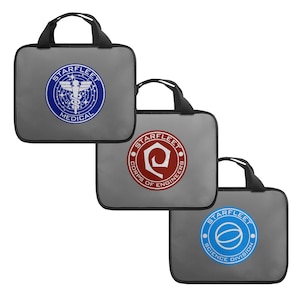 May include: Three gray laptop bags with black handles and Starfleet logos. The logos are for Medical, Corps of Engineers, and Science Division.
