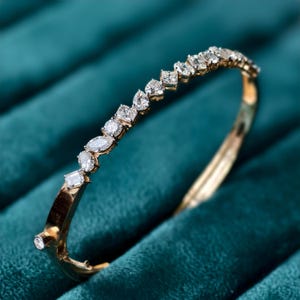 gold bangle set with multi-shape lab diamonds in gold