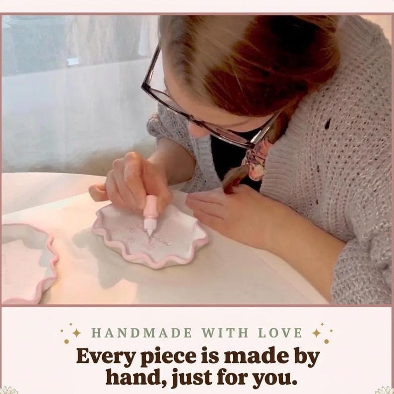 May include: A white scalloped edge tray being decorated with a small pink squeeze bottle. The text below reads: HANDMADE WITH LOVE. Every piece is made by hand, just for you. The tray has a smooth surface and a raised, wavy border in light pink.