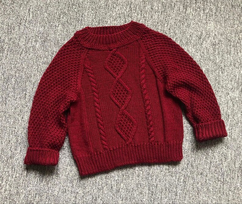 Handgestrickter Babypullover / Geflochten / Merinowolle Bild 1