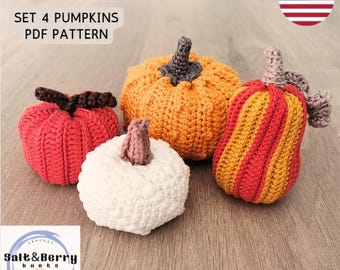 May include: Set of four crocheted pumpkins in various colors, including orange, red, and white. The pumpkins are arranged on a wooden surface. The text "SET 4 PUMPKINS PDF PATTERN" is visible at the top of the image.
