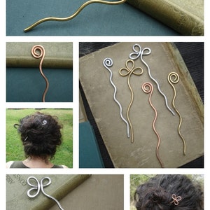 May include: A set of five hair pins with different decorative ends. The ends are either a spiral or a clover shape. The pins are made of metal in silver, gold, and copper tones.