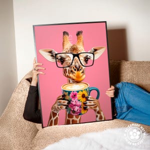 a woman sitting on a couch holding a picture of a giraffe