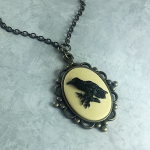 Ivory and Black Raven Whimsigoth Cameo Necklace with Antiqued Brass