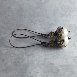 Ivory Pearl and Amber Yellow Whimsigoth Earrings with Antiqued Brass