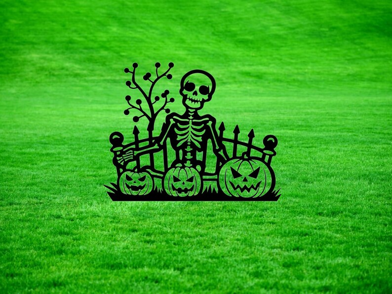 May include: Black metal silhouette of a skeleton sitting on a fence with three jack-o'-lantern pumpkins. The skeleton is holding a pumpkin in its left hand. The fence has a small tree behind it.