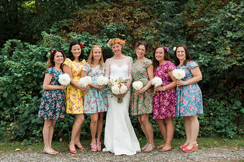 Floral bridesmaids dresses mismatched coordinating tea dress cap sleeve vintage style floral print summer wedding colourful bright