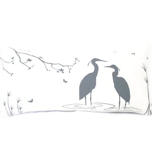 May include: A white rectangular pillow with a gray silhouette design of two herons standing in a pond with a branch of a tree with leaves and butterflies above them.