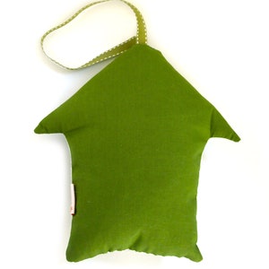May include: A green fabric house-shaped pillow with a white dotted green ribbon loop for hanging.