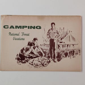 May include: A vintage rectangular brochure with a light tan background featuring dark brown ink illustrations of people camping. The text reads CAMPING National Forest Vacations. The scene depicts two people cooking over a fire and one standing.