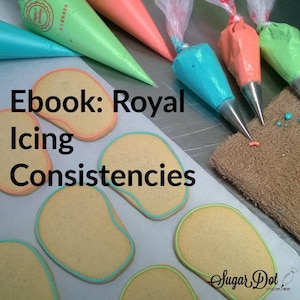 May include: Close-up of various piping bags filled with different coloured royal icing. The bags are arranged on a white surface with several sugar cookies. The text "Ebook: Royal Icing Consistencies" is written in black on the surface. The text "Sugar Dot Cookies" is written in black on a white background with a red and white candy cane graphic.