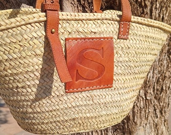 Handwoven straw bag with adjustable leather straps handles