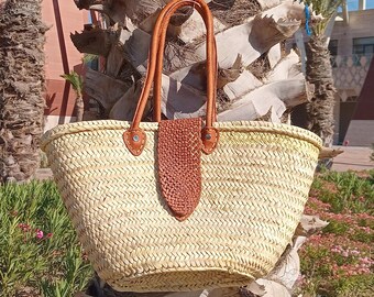 Woven straw tote bag with leather straps