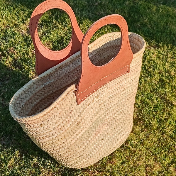 Handwoven straw bag with leather handles