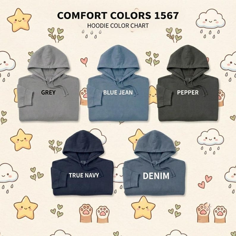 May include: A Comfort Colors 1567 hoodie color chart featuring five hooded sweatshirts in grey, blue jean, pepper, true navy, and denim. Each hoodie includes a drawstring hood and is labeled with its respective color name in white text.