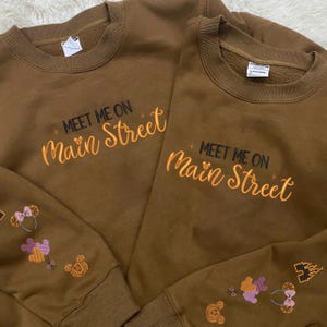 Meet me on Main Street Embroidered Sweatshirt, Magical Land Embroidered Shirt, Custom Designs on sleeves shirt, Halloween Coquette Shirt