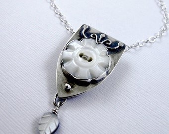 Vintage Button Necklace: Flower Mother of Pearl Button with Shield Setting and Mother of Pearl Leaf Dangle
