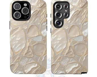 May include: Two phone cases with a mosaic design in cream and beige tones. The cases feature a pattern of irregular shapes separated by thin, light-colored lines. The cases have camera cutouts and the text "BLUE APE BRAND" at the bottom.