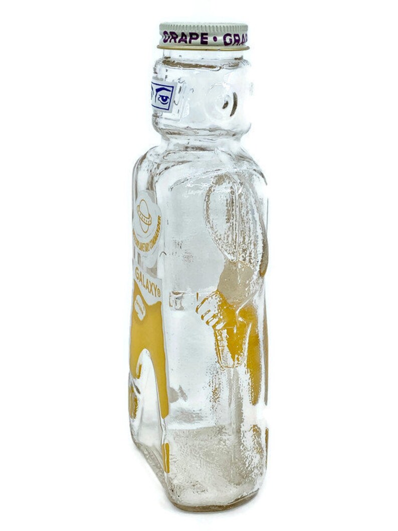 Astronaut Space Warrior Galaxy Glass Syrup Bottles Vintage Spaceman Glass Bank Yellow Interplanetary Commander New Old Stock