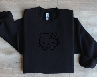 Von Hello Kitty inspiriert: Kawaii-Sweatshirt mit Girly-Kokette-Stickerei, Geschenk für Sie. Monochromes, minimalistisches, schickes Kitty-Sweatshirt mit schlichtem Rundhalsausschnitt