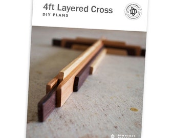 May include: DIY plans for a 4ft layered cross made of wood. The cross is made of multiple layers of wood, each a different color. The cross is shown on a light brown surface.