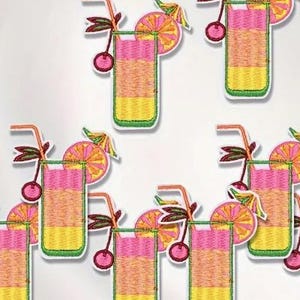 May include: Eight embroidered iron-on patches featuring a pink and yellow cocktail drink with a cherry, orange slice, and green leaves.
