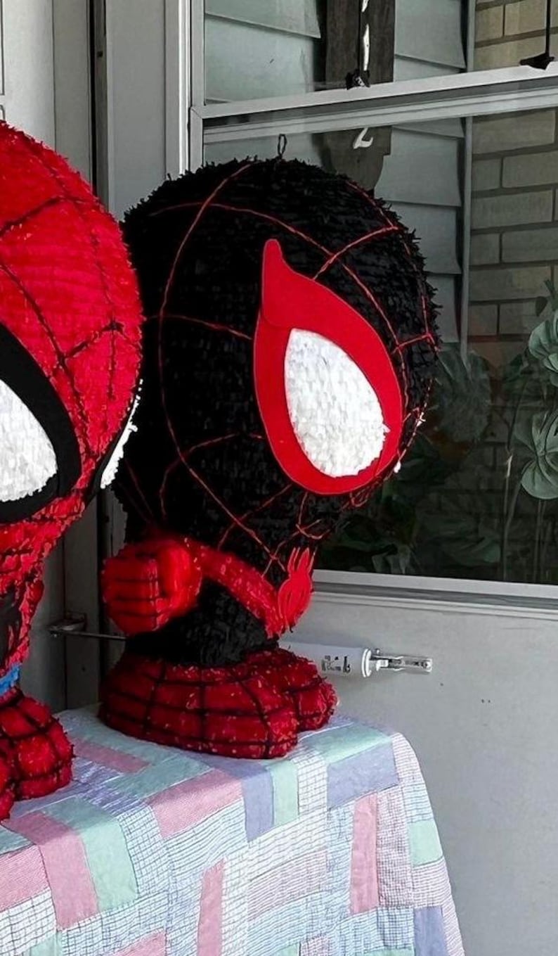 May include: A set of three ceramic mugs with a speckled, matte finish. The mugs are in shades of cream, light gray, and dark gray. Each mug has a simple, minimalist design and a rounded handle.